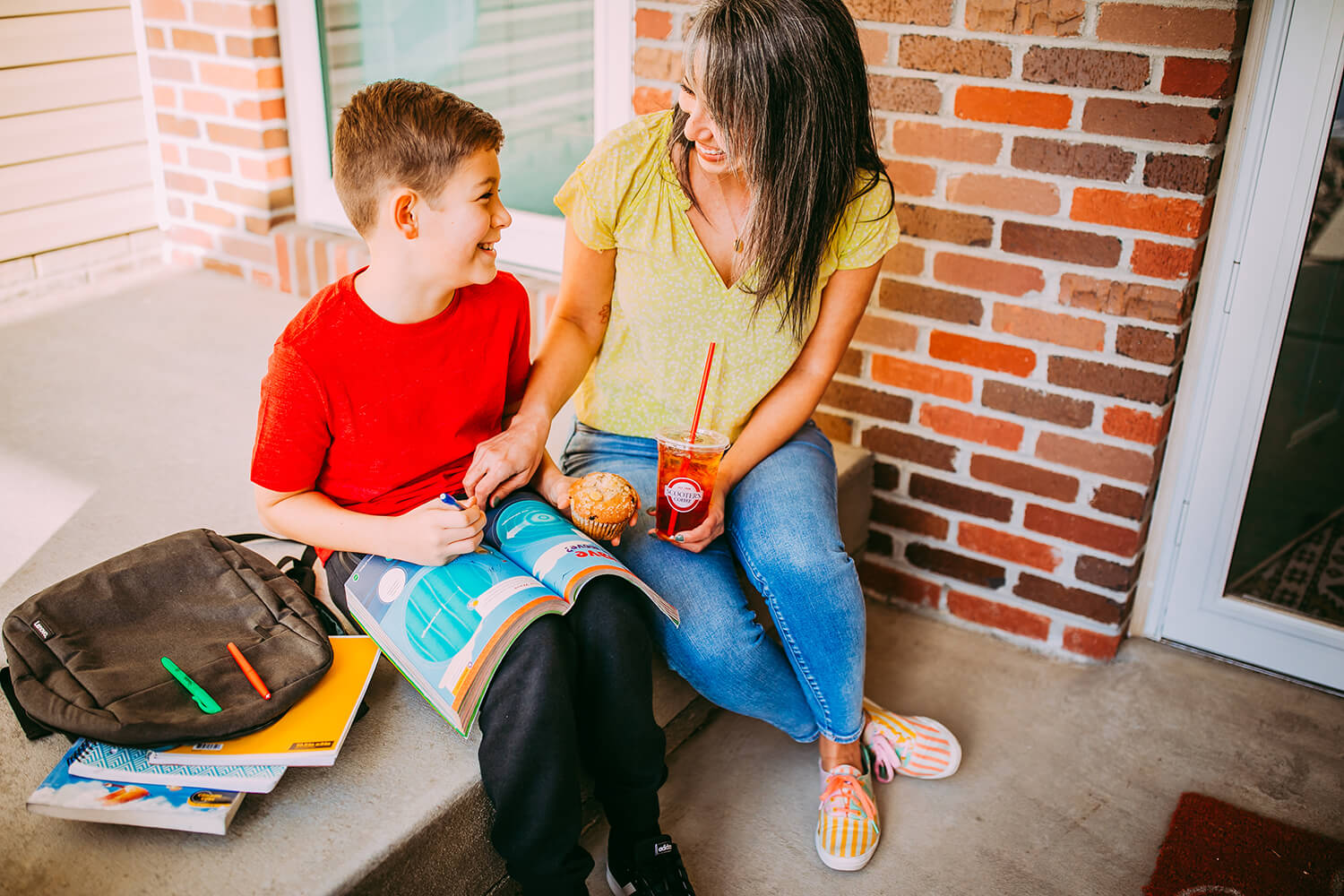 Mother and son sitting on steps