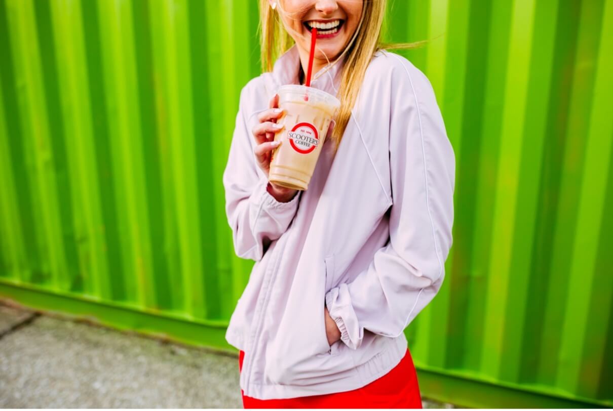 Woman smiling drinking coffee