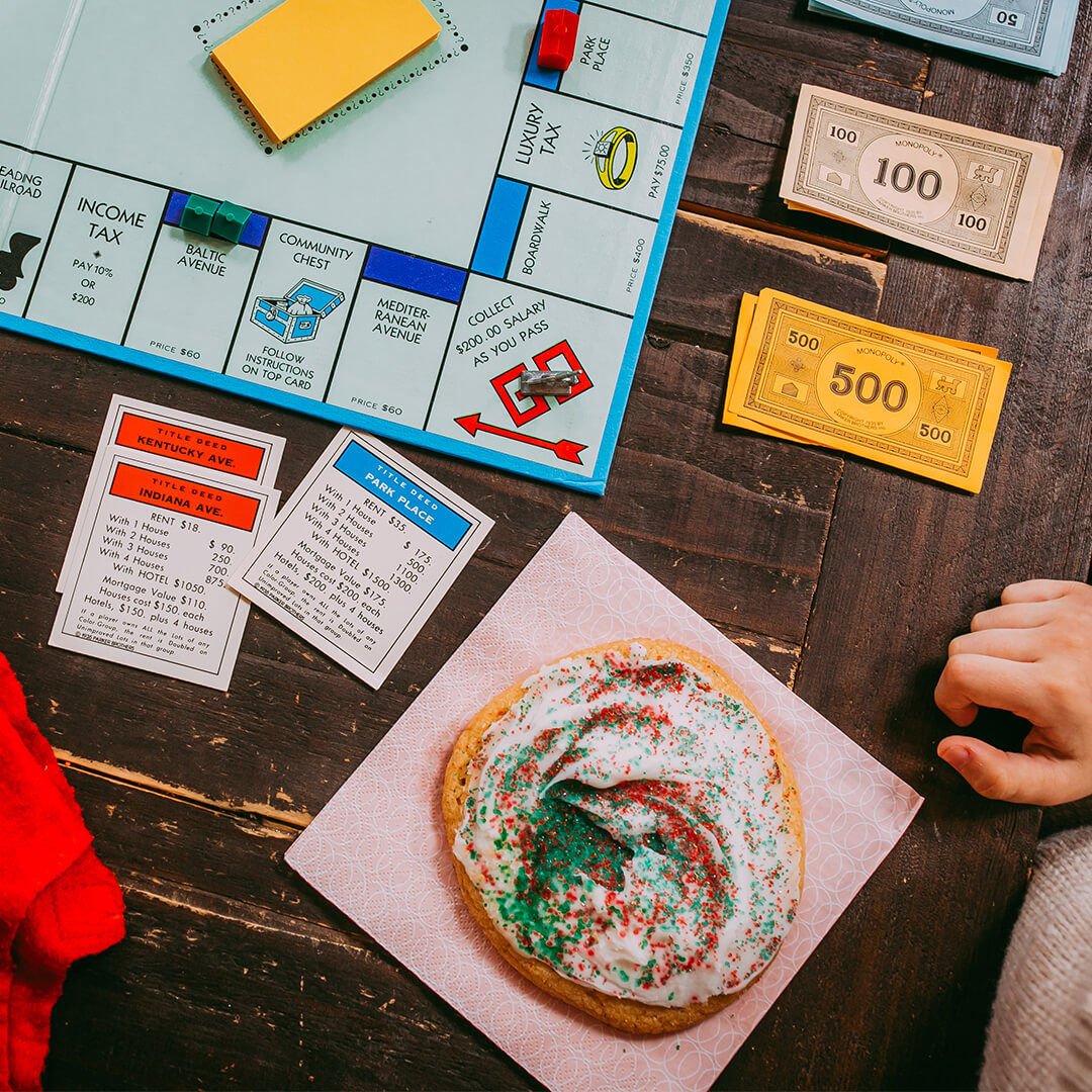 Frosted Sugar Cookie next to board game 