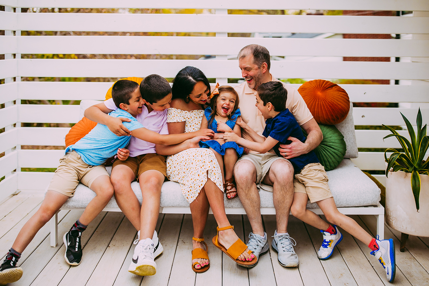 Family laughing on patio