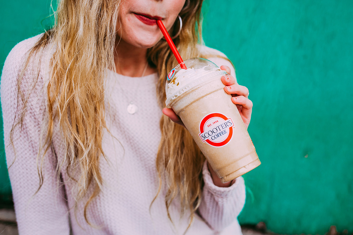 Woman drinking coffee blender