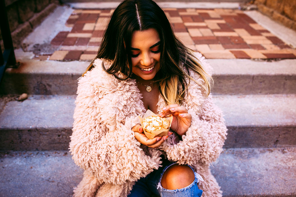 Woman holding muffin