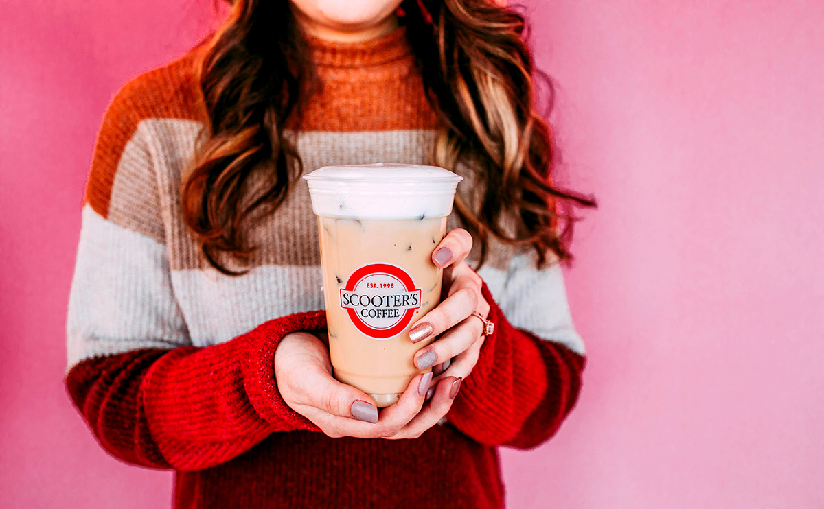 Woman holding iced coffee